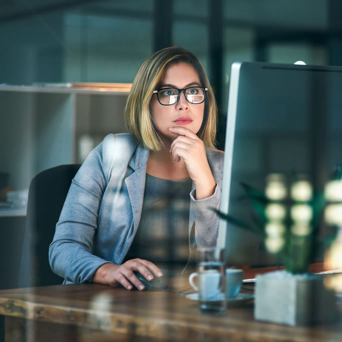 1business-woman-think-computer-night-reading-email-planning-working-project-office-m Sterling Phoenix | Karie Barrett